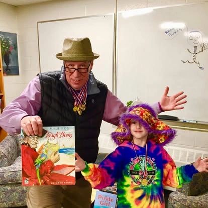 Jesse Turner with child at educational community event